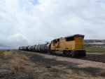 UP SD59MX #9907, running LHF, leads the southbound Cache Valley Local (LCG-41E) approaching the W. 4600 N. at Cache Junction, Utah. April 15, 2022